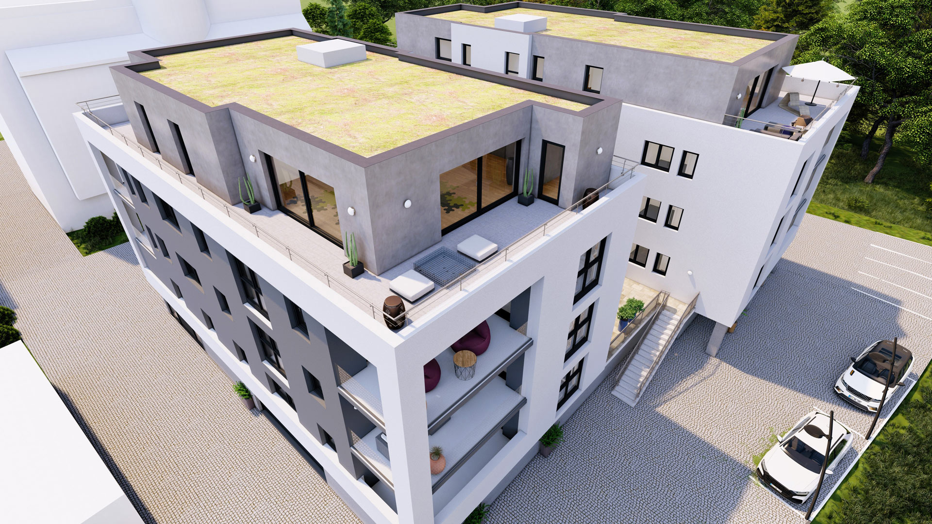 Dachterrasse und Parkplatz eines Mehrfamilienhauses